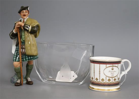 An Orrefors oval glass vase engraved with a young girl, signed, and a Royal Doulton figure, The Laird